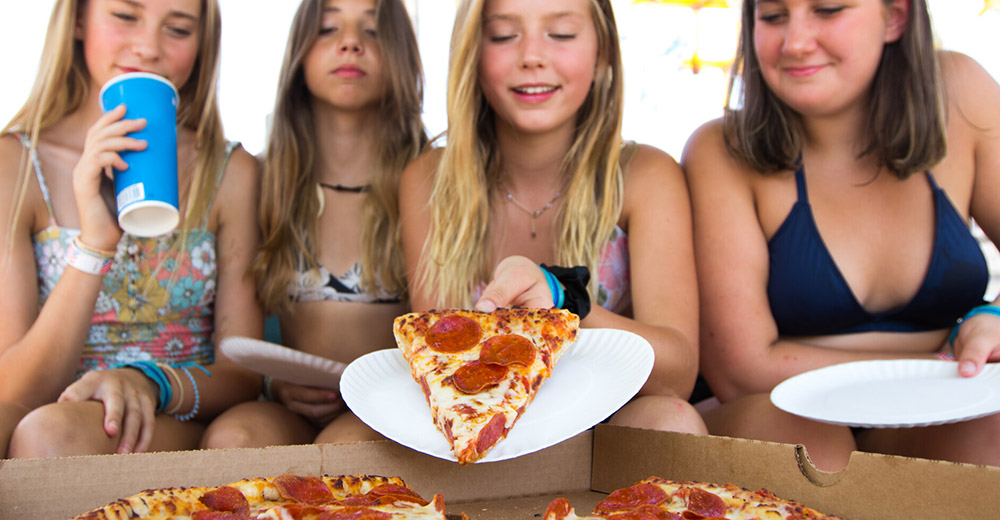 Girls eating pizza